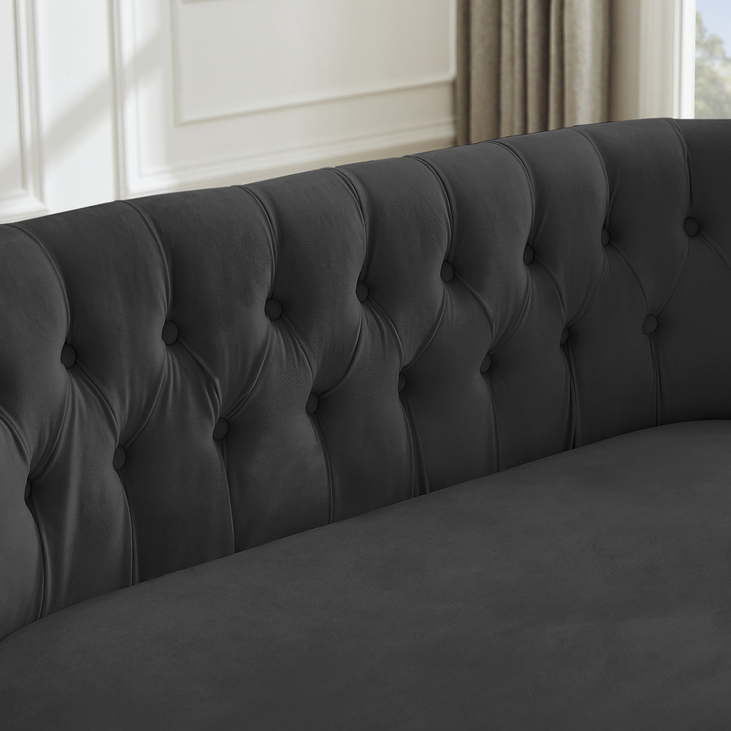 black sofa with nailhead arms