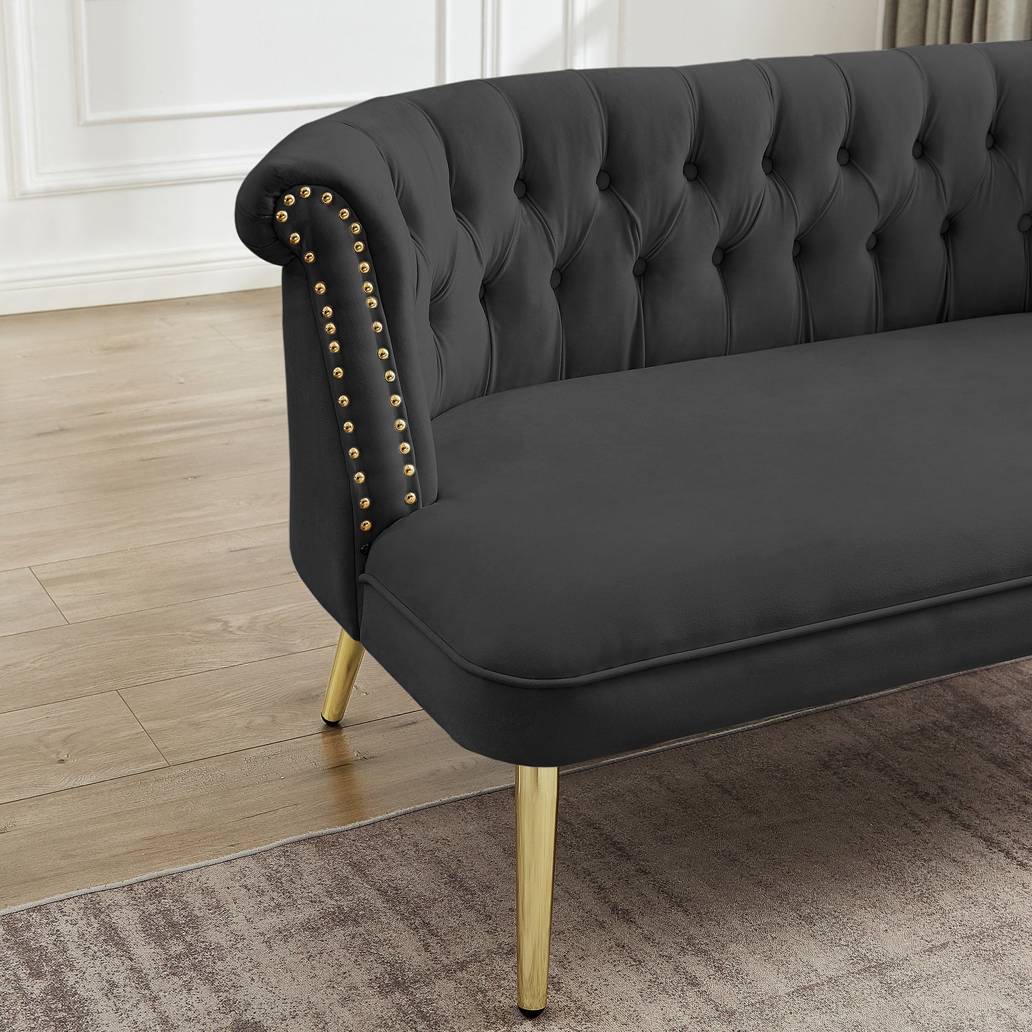 black sofa with nailhead arms