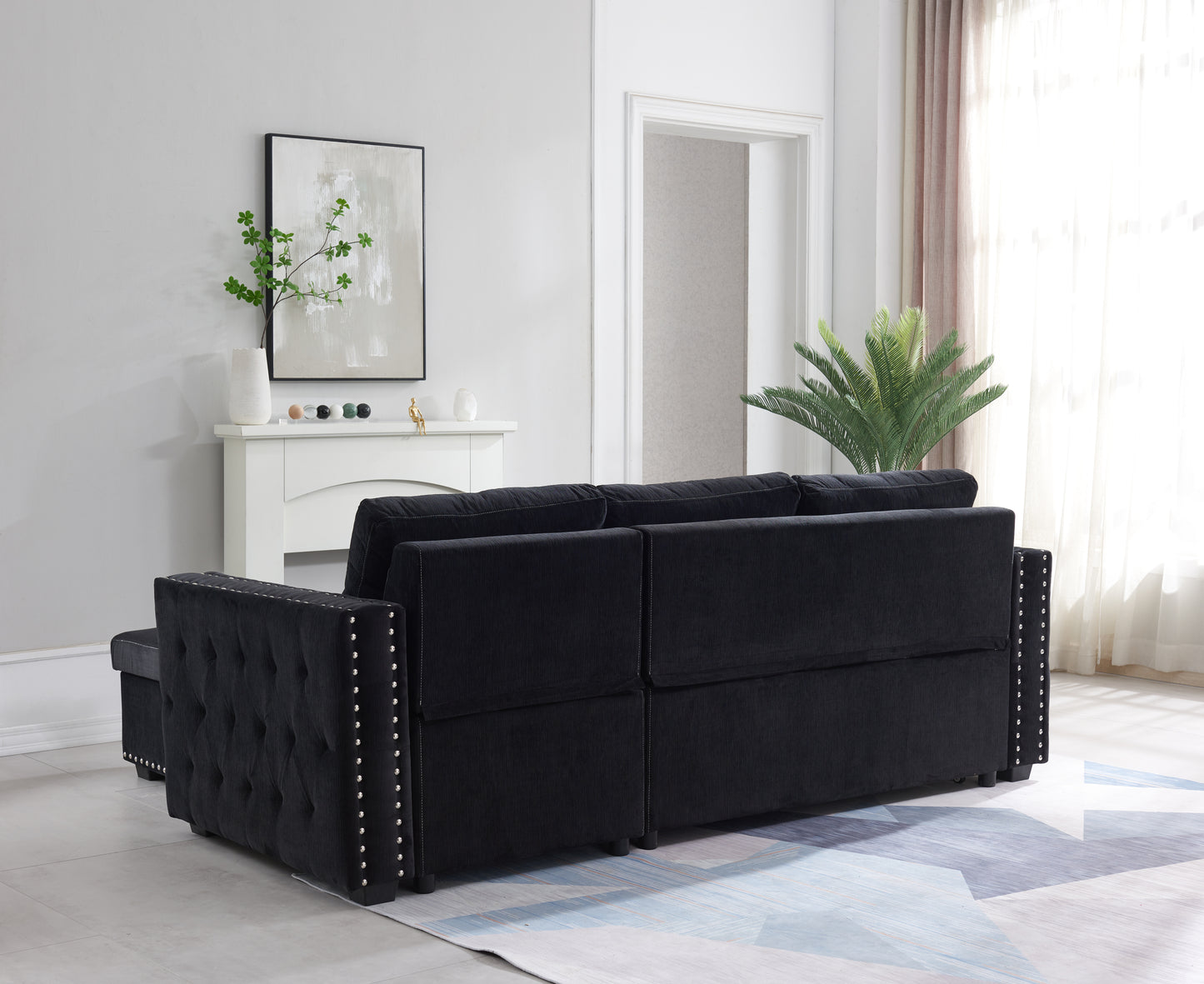 Elegant Black Sectional Sofa with Pull-Out Bed and Reversible Chaise