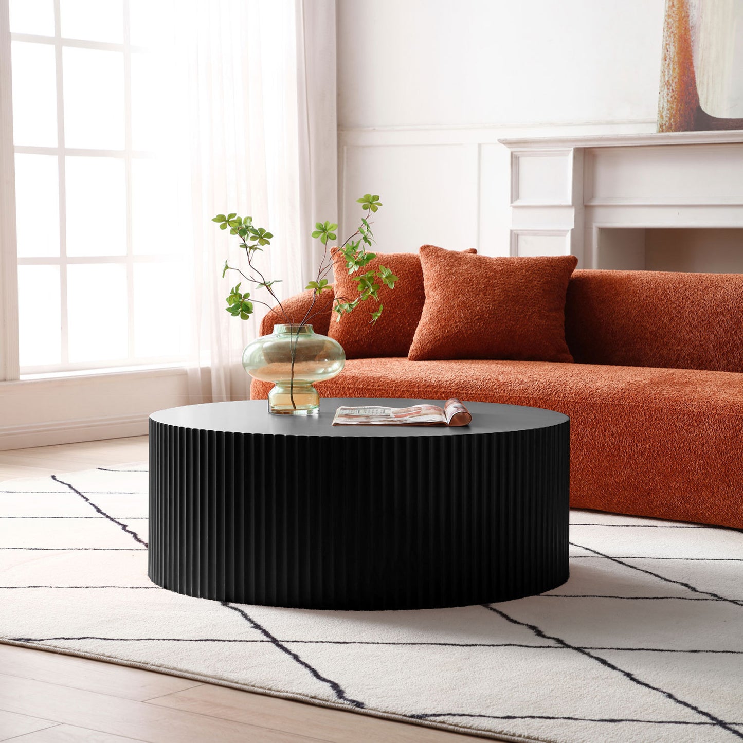 Elegant Black Round Coffee Table with Intricate Relief Design