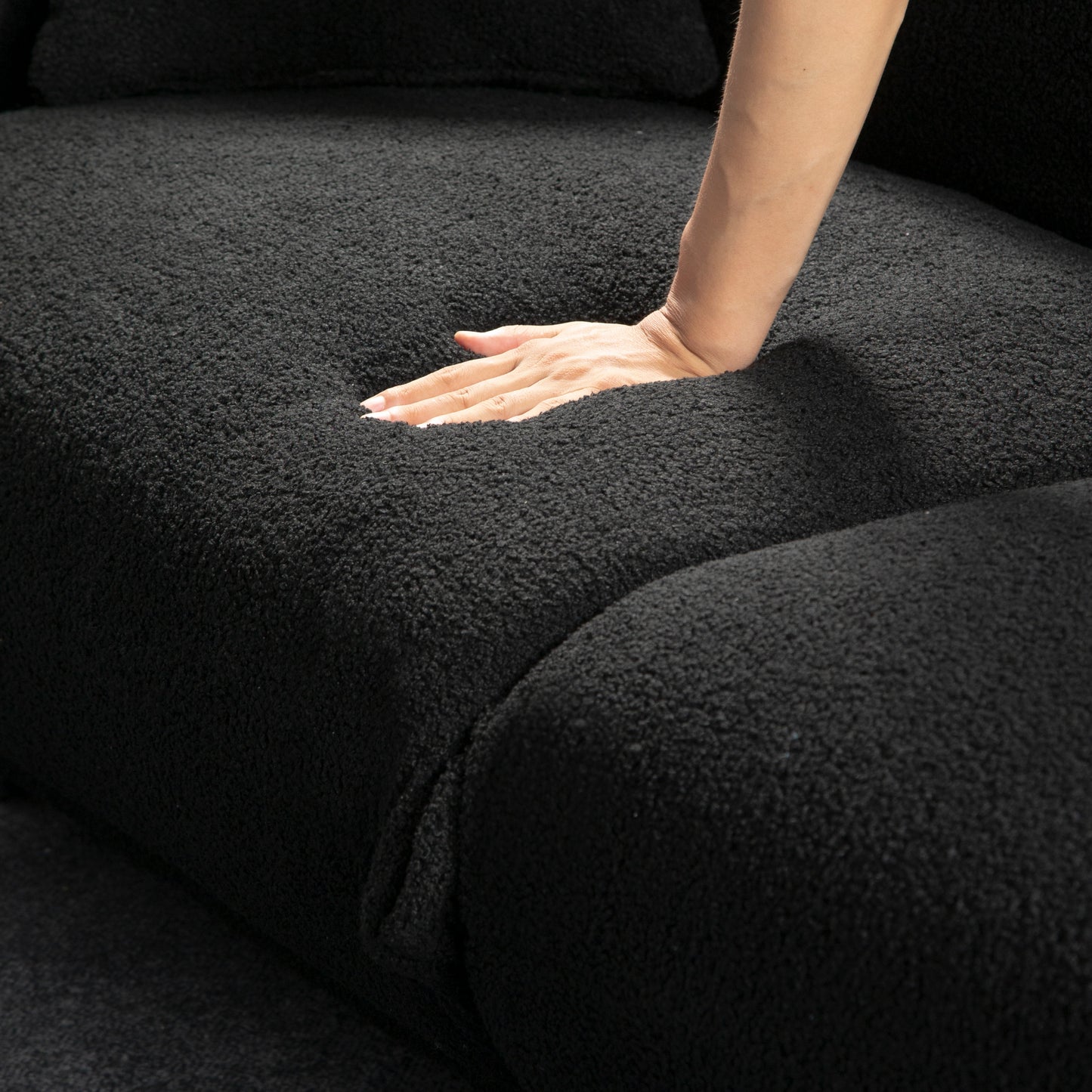 A lovable, fat, bread-like sofa with 2 pillows and metal feet with anti-skid pads