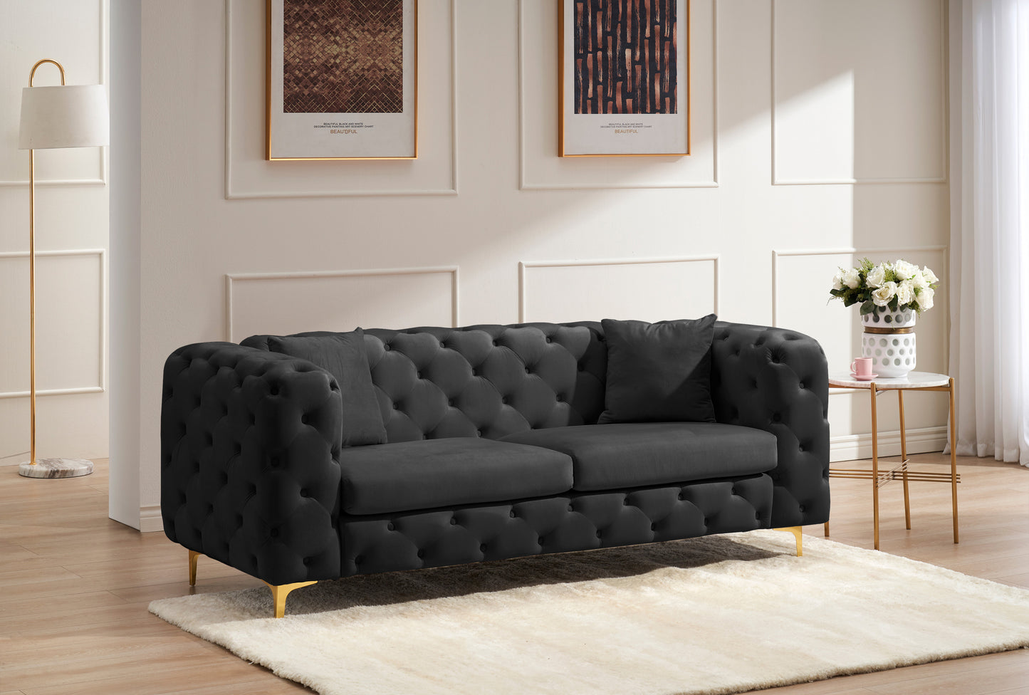 New design comfortable black loveseat with two throw pillows in the same color