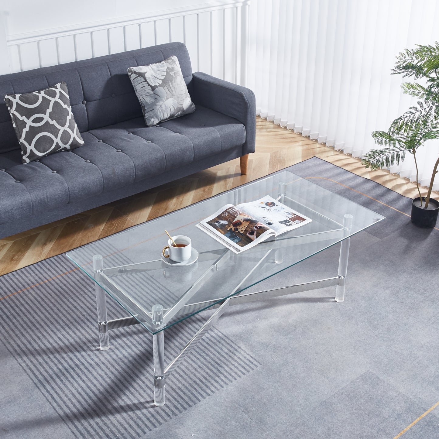 Elegant Silver Stainless Steel Coffee Table With Clear Glass Top and Acrylic Legs