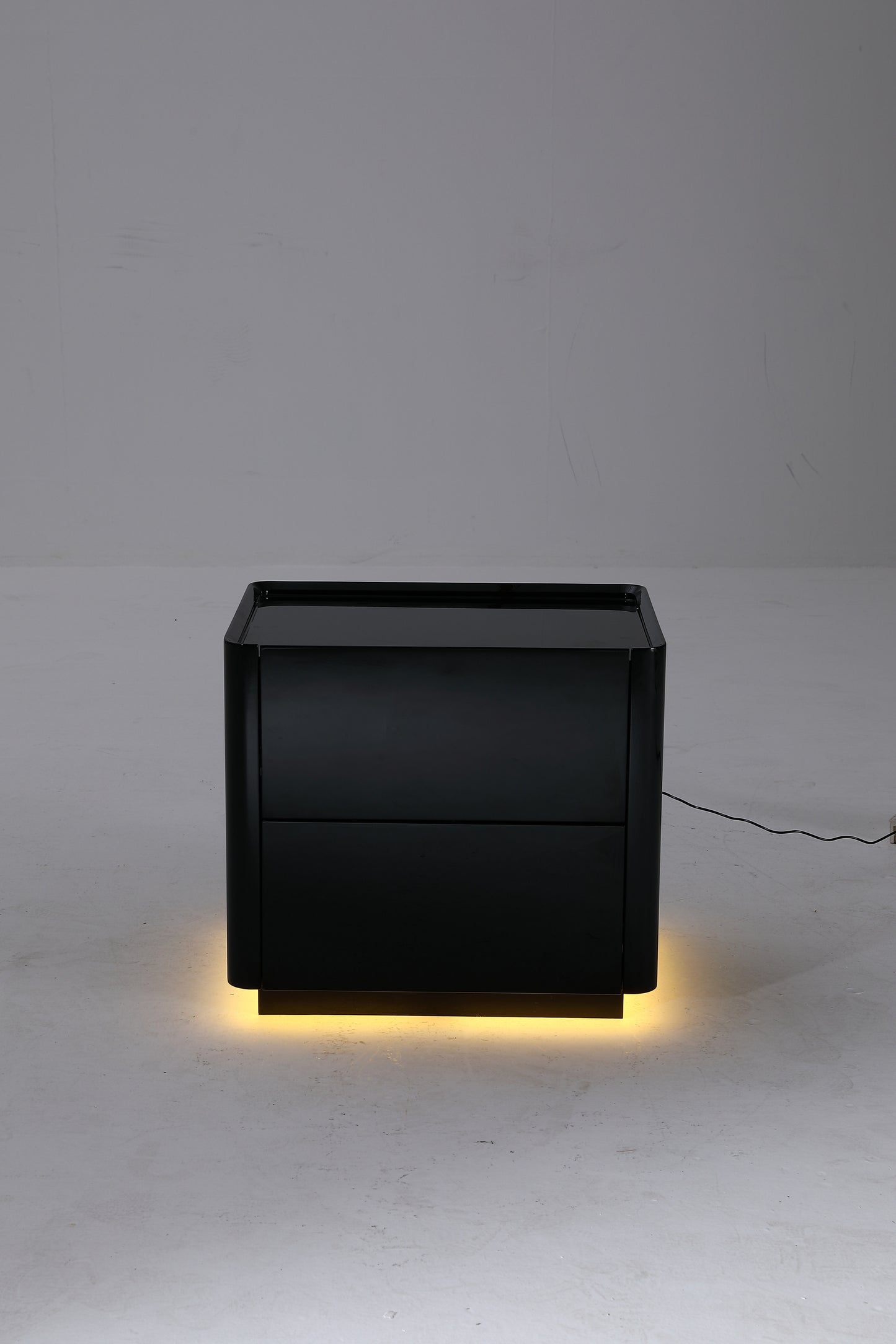 Glossy Lacquered Black Wood Nightstand with Warm Yellow Tone Sensor Lighting Strip