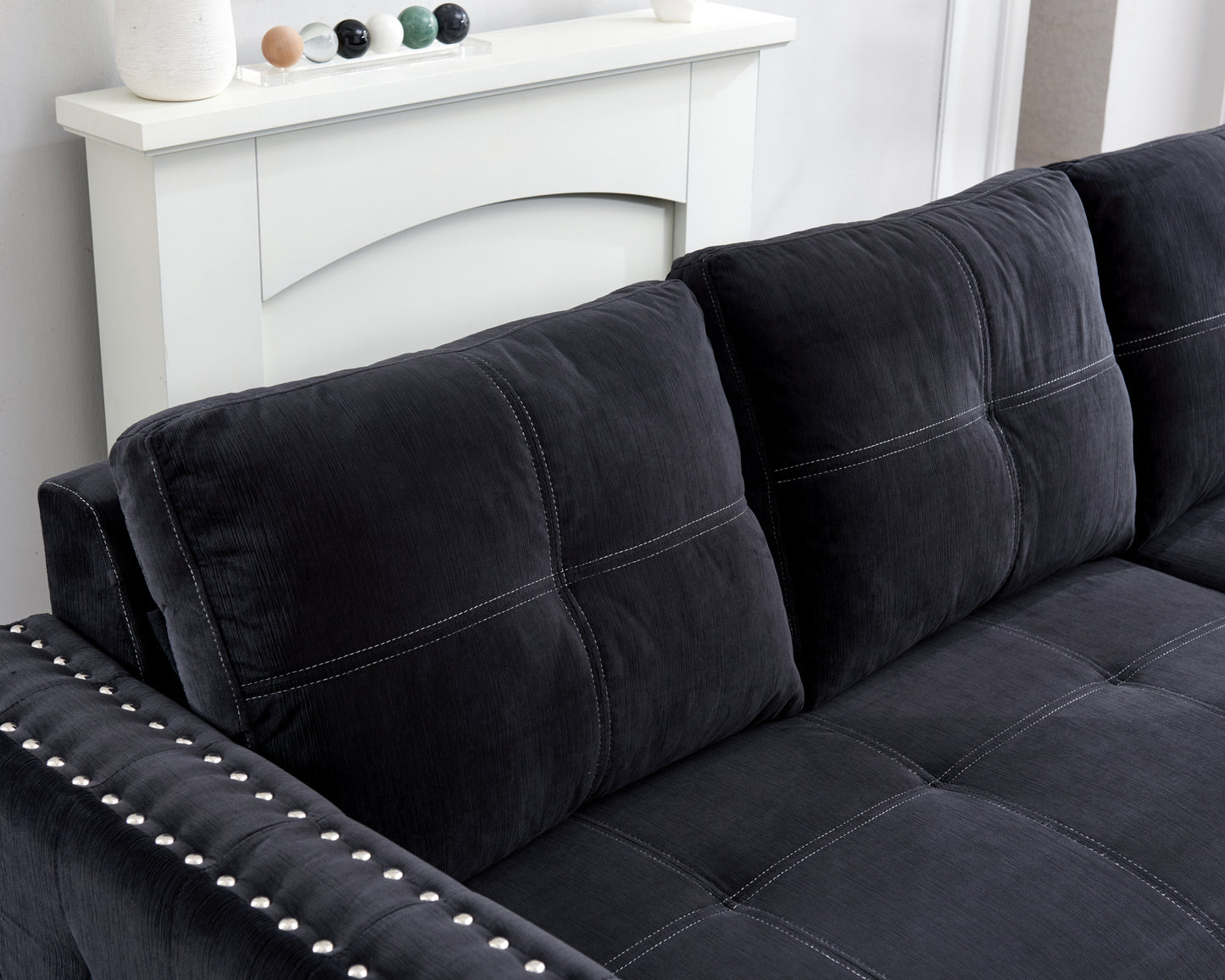 Elegant Black Sectional Sofa with Pull-Out Bed and Reversible Chaise