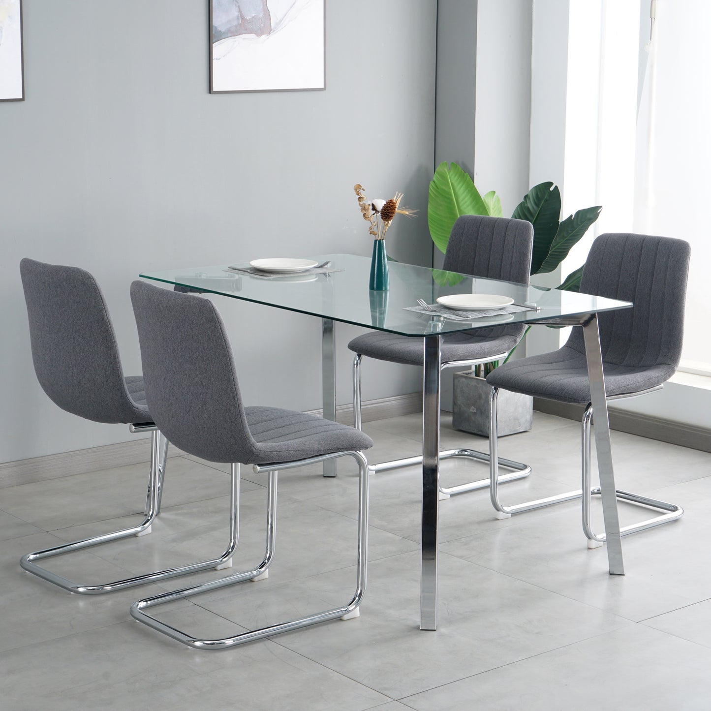 51.1" Table and chair set, one table and four chairs. Clear tempered glass table top, 0.3" thick, silver metal legs. fabric chair with electroplated metal legs.